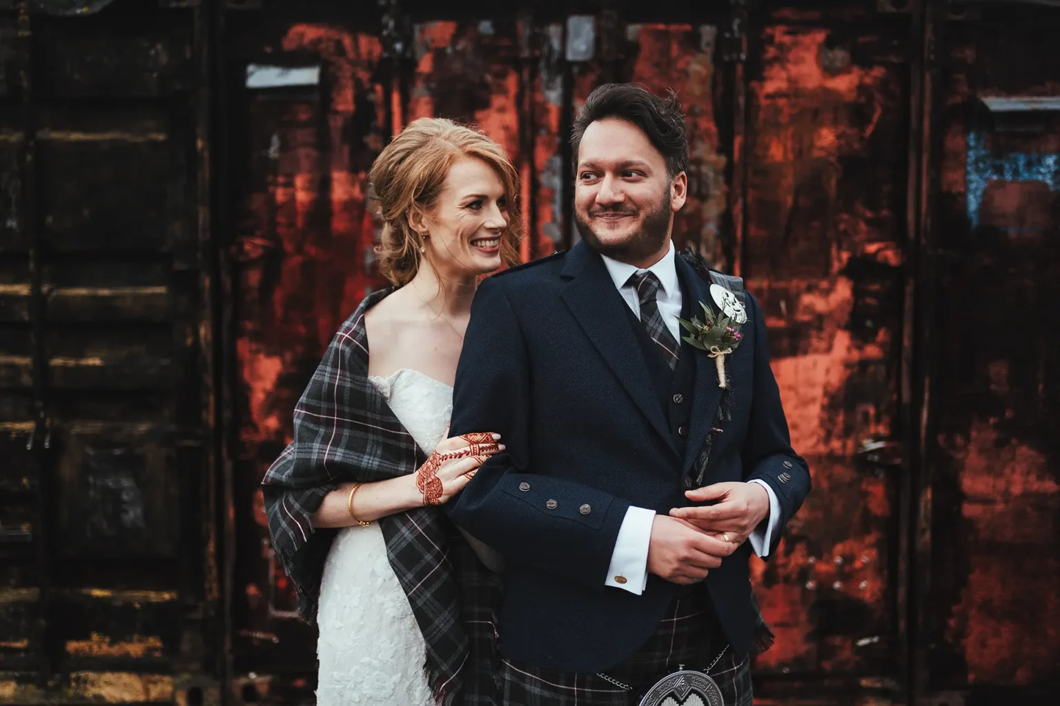 Bride and groom dressed for their winter wedding at Clock Barn